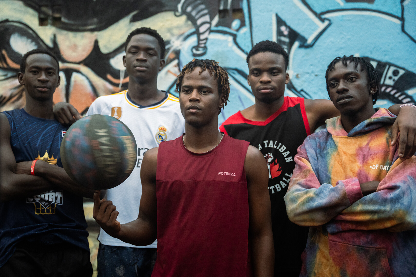 Five young players posing together in Kibera